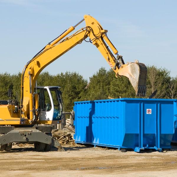 roll-off dumpster placed in a residential driveway